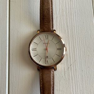 Rose gold Fossil watch with brown band